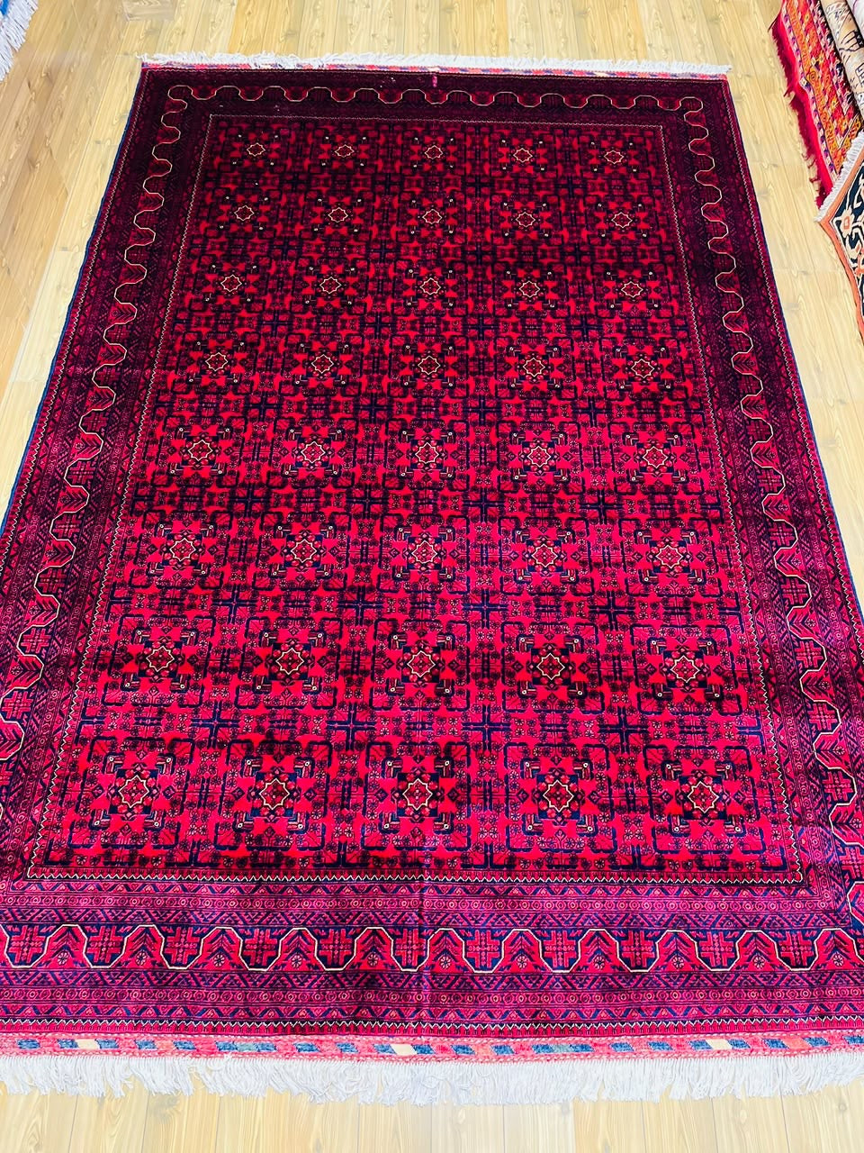 Khal Mohammadi hand-knotted Afghan rug, crimson field with navy gul medallions, 7x10